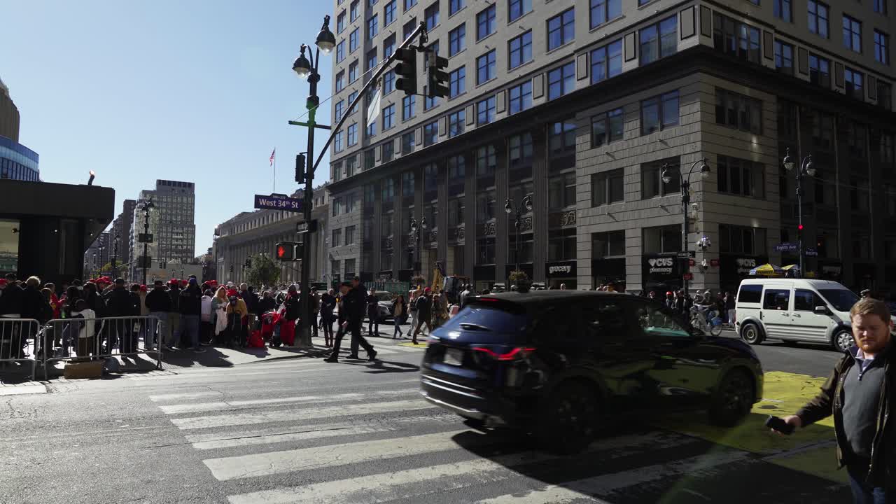 Under the golden sun, large crowds gather around Madison Square Garden in New York, waving and cheering in support of Trump’s presence