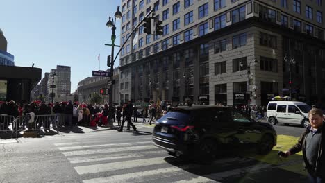 under the golden sun, large crowds gather around madison square garden in new york, waving and cheering in support of trump’s presence