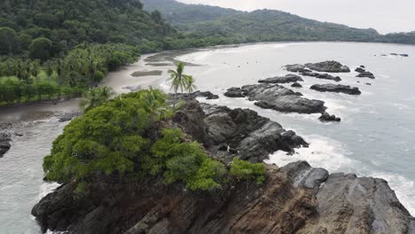 excellent aerial shot of a rocky shoreline in costa rica