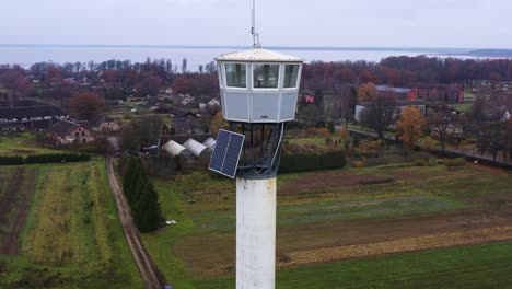 Firefighter-observation-tower-in-Burtnieki,-Latvia,-aerial-parallax-view