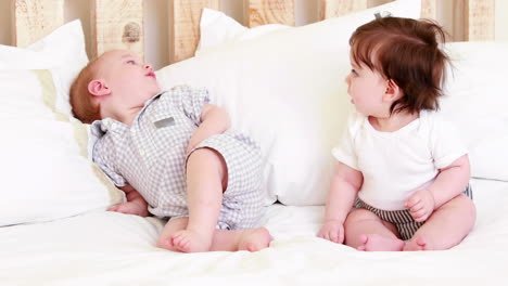 Cute-babies-on-a-bed