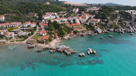 Aerial-view-of-the-Loutra-village-located-on-the-cliffs-and-by-the-sea-of-Chalkidiki