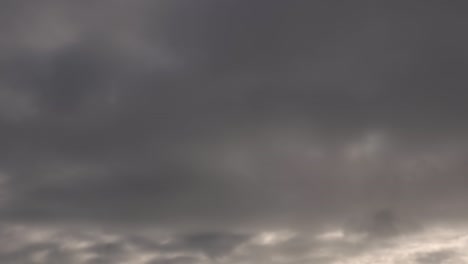 grey sky timelapse of clouds in distance just before storm weather at sunset