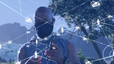 Animation-of-network-of-connections-over-senior-african-american-man-using-smartphone-at-beach