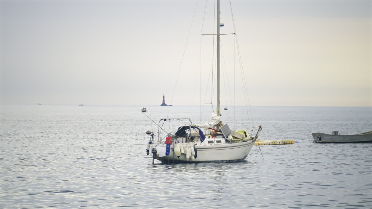 Multiple white boats docked on the sea in daylight in the French Riviera
