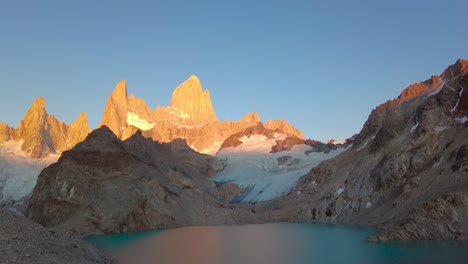 beautiful timelapse of a sunrise in mount fitz roy, the most iconic mountain in patagonia, by the shores of laguna de los tres