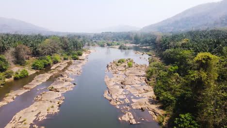 rocky river in india - waterway with rugged terrain surrounded by breathtaking mountain landscapes