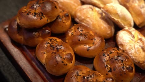 multiple caramelized and creamy soft buns kept in the tray for display to sell in the kolkata