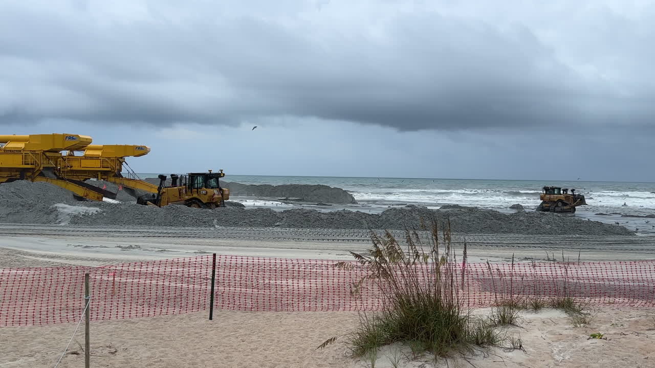 Piles of sand pumped onshore for beach replenishment, stabilization