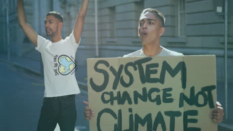 animation of save the earth, earth day text and heart shaped earth over diverse men at protest