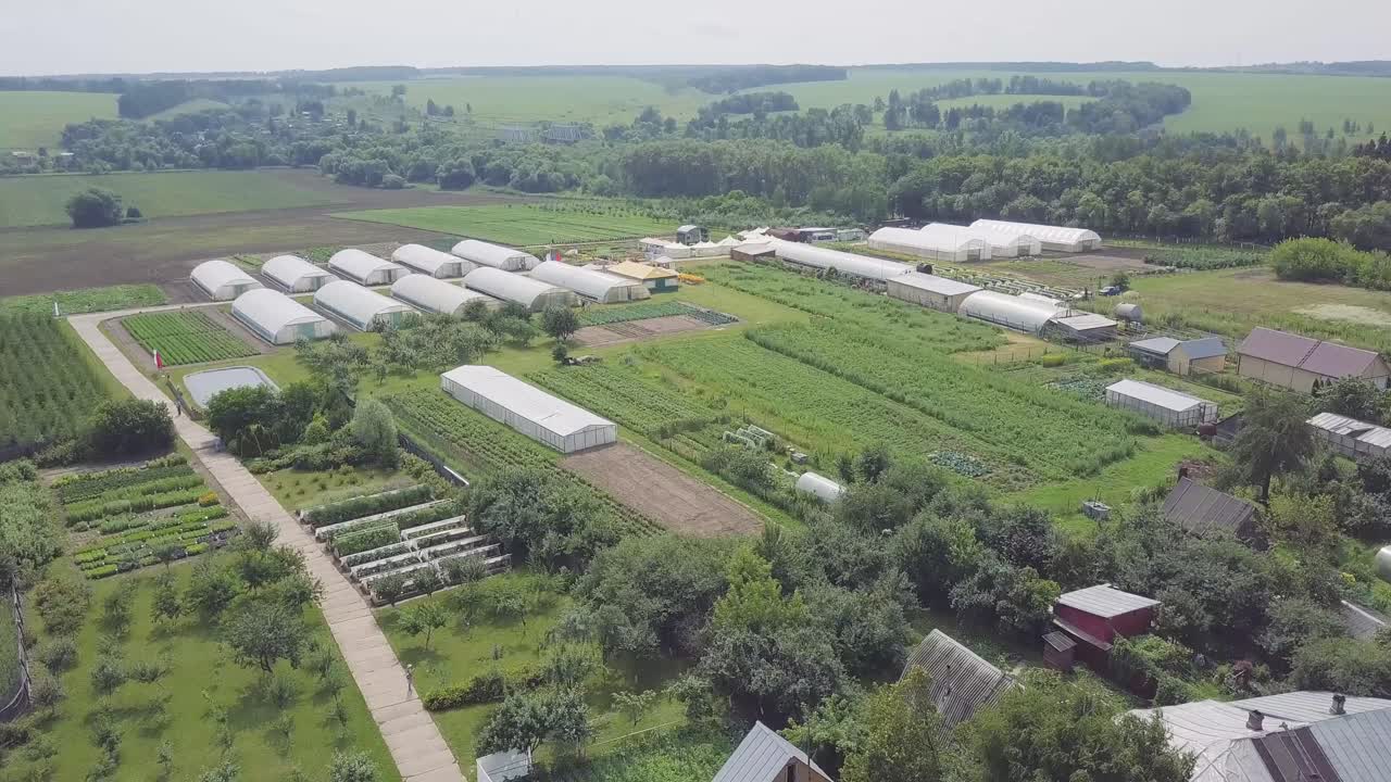 Aerial View of a Farm with Greenhouses
