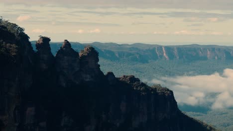 three towering sandstone peaks of the three sisters in the blue mountains national park, new south wales, australia. static shot