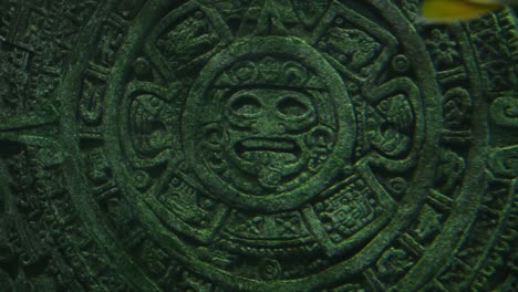 aztec sun stone stands underwater