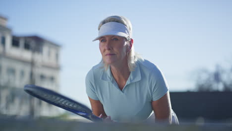 senior woman playing tennis