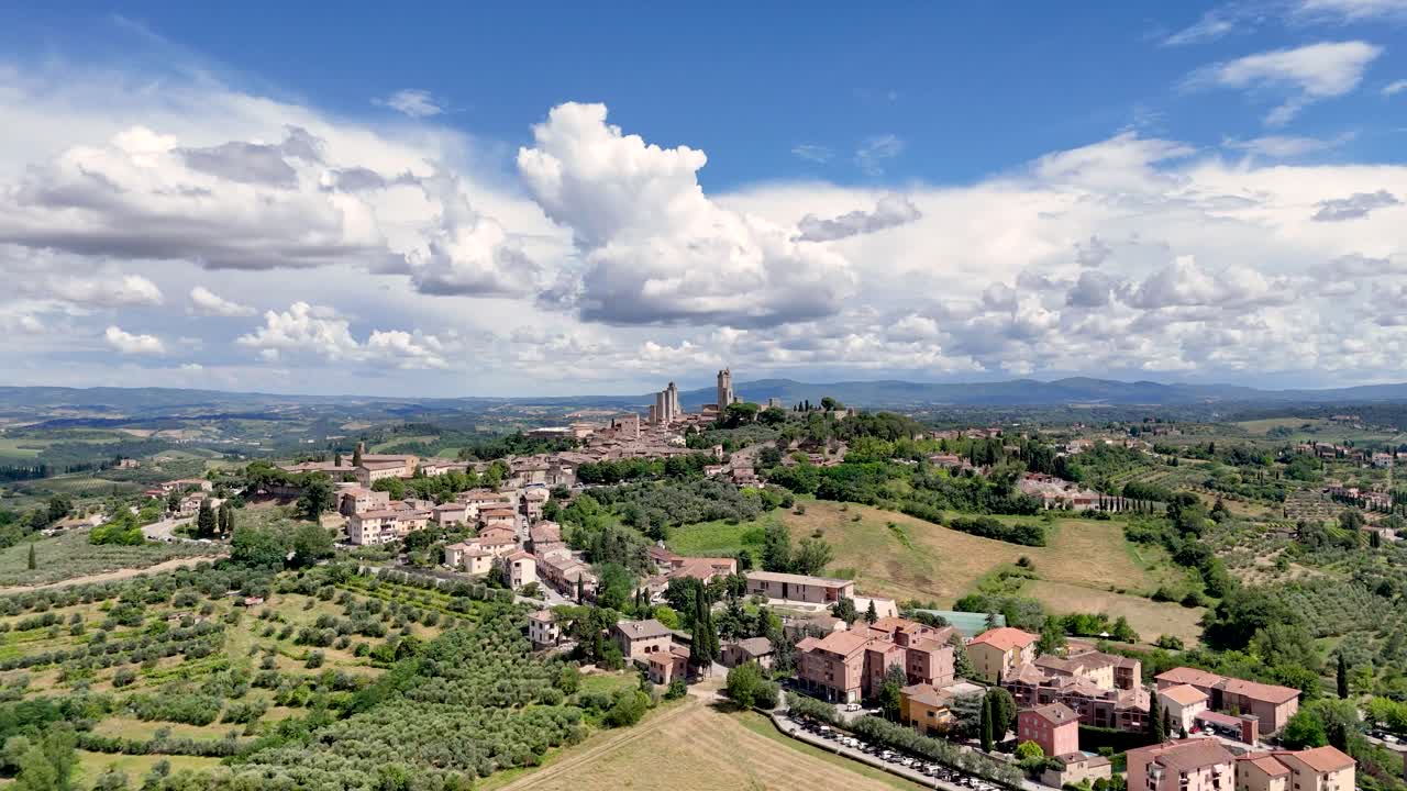 Italy, Tuscany, Val d'Elsa. Aerial view of the medieval village of San Gimignano, a Unesco World Heritage Site. DJI_20240625153543