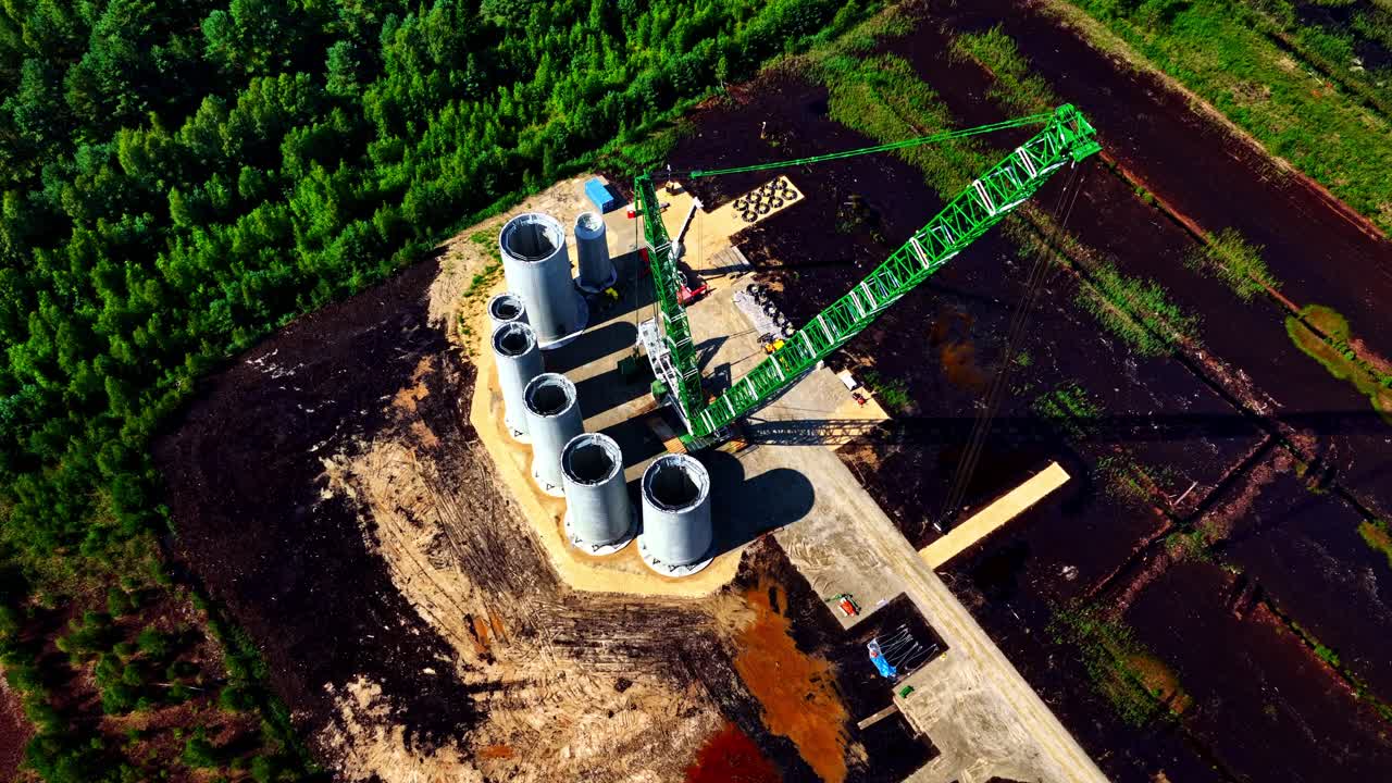 Wind park turbine construction using large crane in rural Latvia