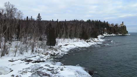 winter snowy forest by the shore of lake superior