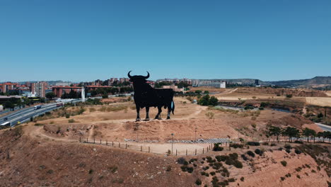 giant bull monument in a cityscape