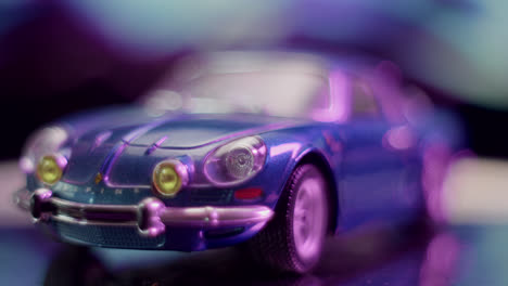 blurred blue toy car with purple bokeh lights