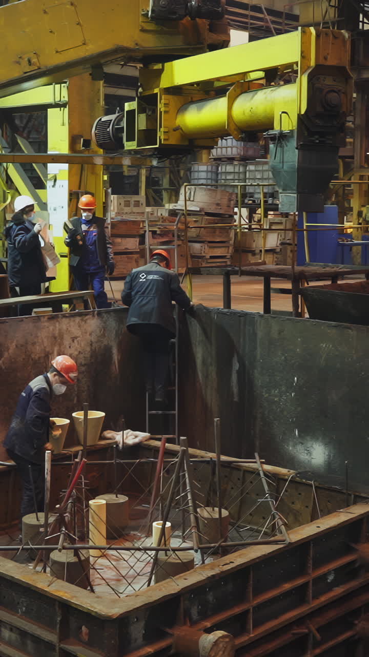 Workers in a heavy industrial factory