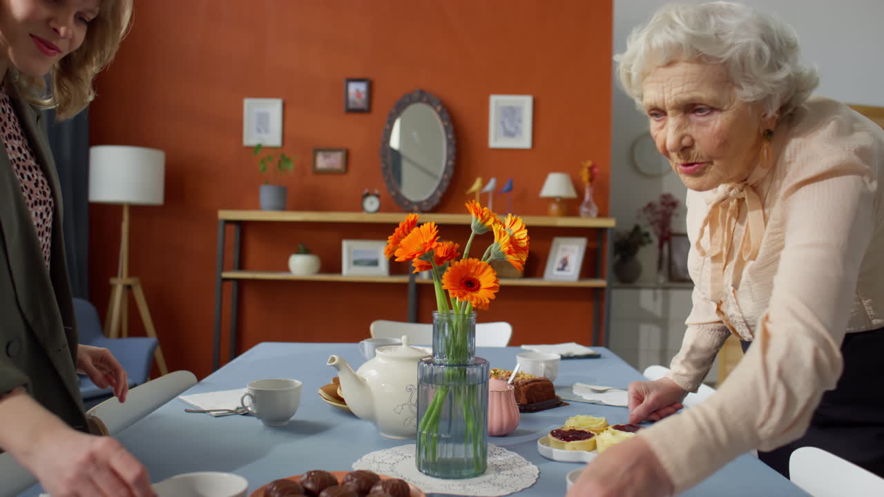 Grandmother and Granddaughter Preparing for Holiday Dinner