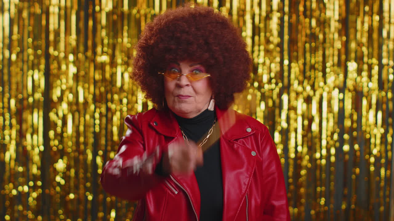 Magician wizard senior woman gesturing with magic wand making wish come true, casting magician spell