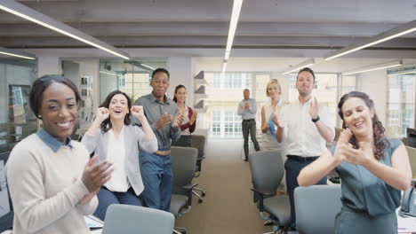 Congratulations-businessman-receiving-praise-as-team-members-clap-in-applause-celebrating-victory-on-return-to-office-slow-motion-walk-POV-shot-concept-series