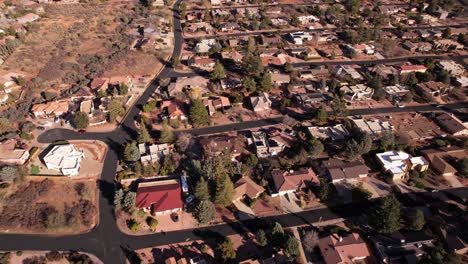 Sedona,-Arizona-USA,-Revealing-Drone-Shot-of-Red-Rock-Hills-and-Towers-Above-Residential-Community