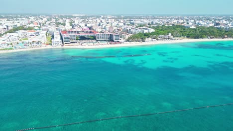 aerial shot of clear turquoise water and beach in playa del carmen, mexico