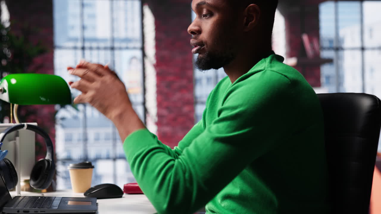 Vertical Video Man feeling exhausted and in pain from lack of sleep at home desk