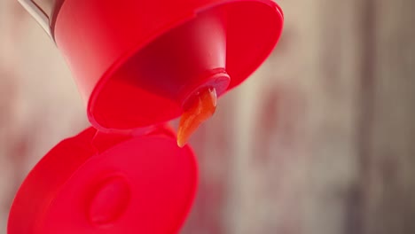 red sauce bottle with dripping product