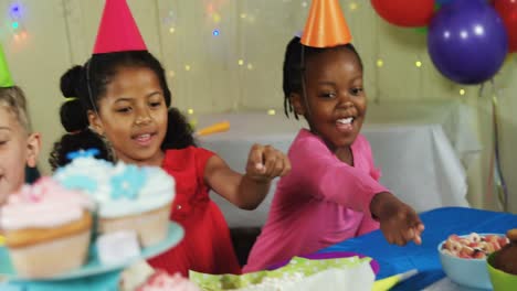 Kids-pointing-at-sweet-foods-during-birthday-party-4k