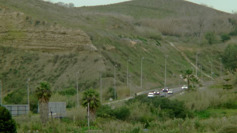 some cars driving down to costa da caparica.