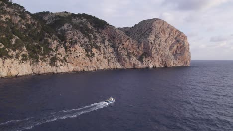 Fishing-vessel-on-ocean-Leaving-a-Path-of-Sea-Foam-water,-aerial