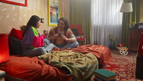 couple enjoying a drink in a cozy vintage bedroom