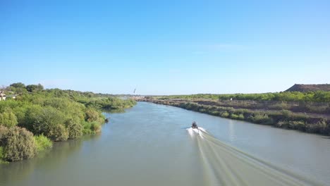 Border-Patrol-as-they-patrol-the-Rio-Grande,-the-border-between-Mexico-and-the-USA,-utilizing-a-hovercraft