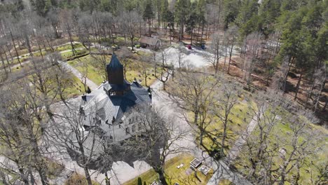 aerial view of medieval erska church in its woody landscape