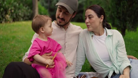 happy family enjoying a picnic in the park