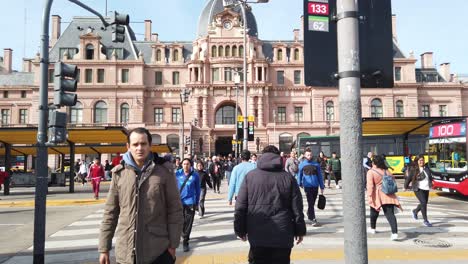 POV Walking at Constitución Railway Station famous landmark of Buenos Aires city at daylight, crowd of people cross the street in historic center