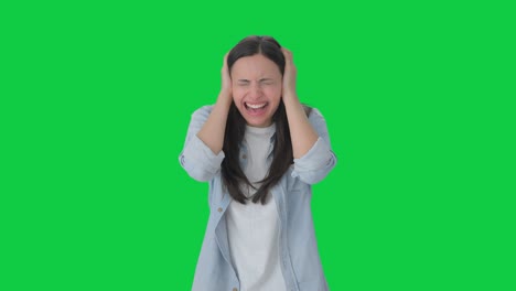 annoyed indian girl shouting loud green screen