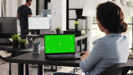 Businesswoman works on laptop