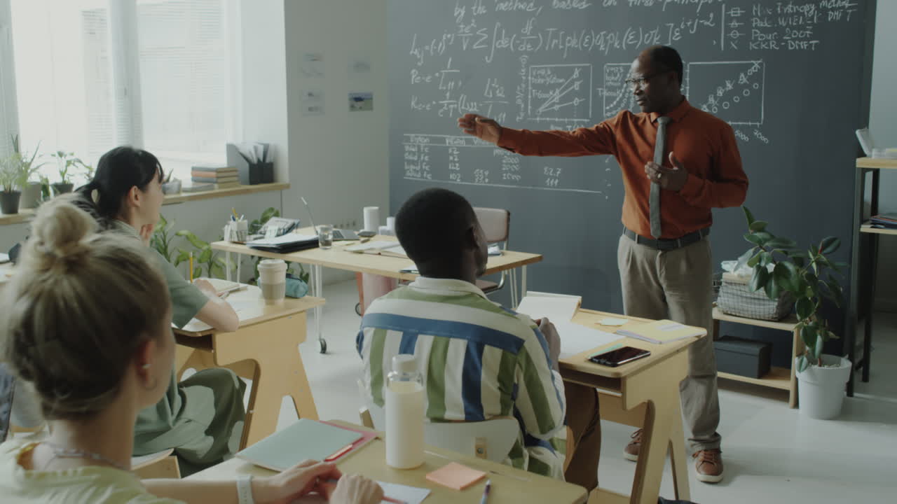 Professor Lectures Students in a University Classroom