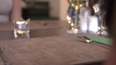 serving dessert in plates on dining table for two customers, close up