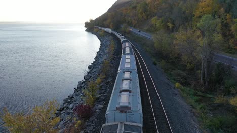 train along the river in autumn