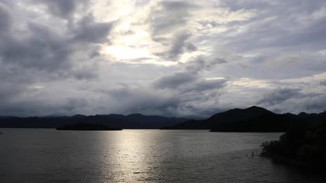 Panoramic-Landscape-Shot-of-Clouds-and-Sunlight-Peering-Through-Over-the-Mountainous-Range-of-Kaeng-Krachan-National-Park-in-Thailand