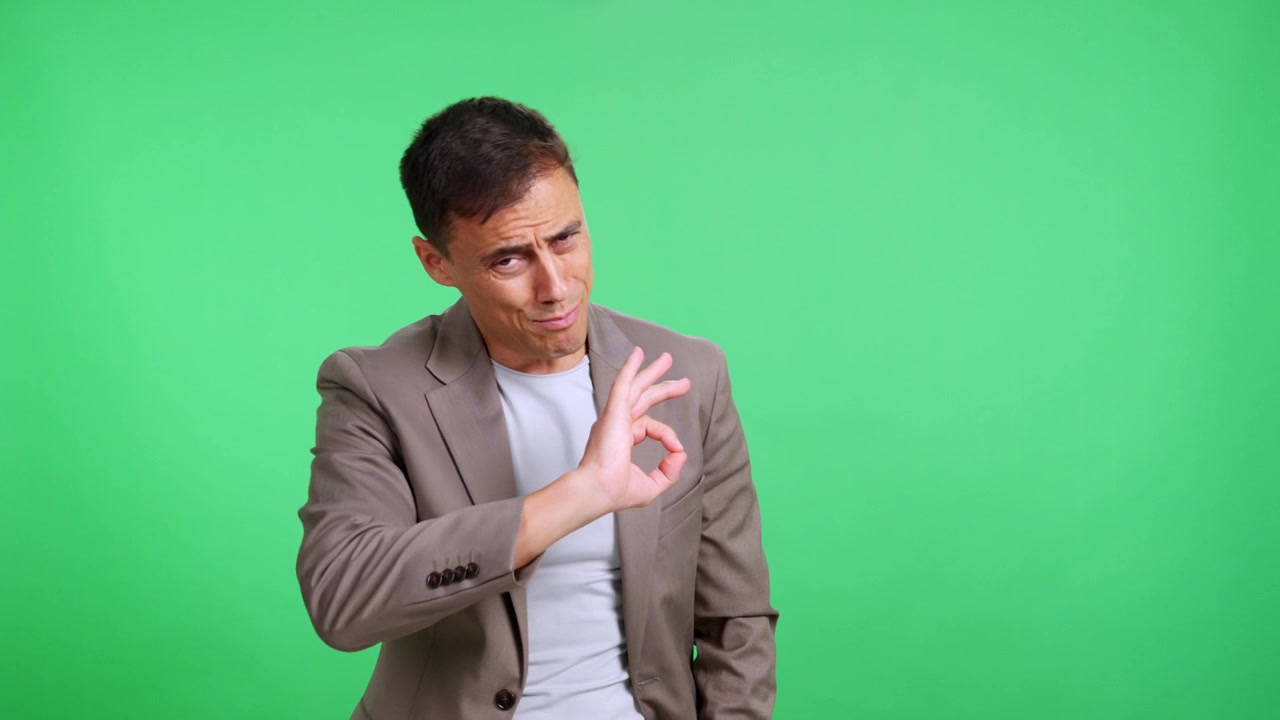 Expressive man presenting a concept on a green screen