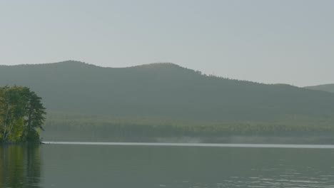 misty morning landscape by a lake