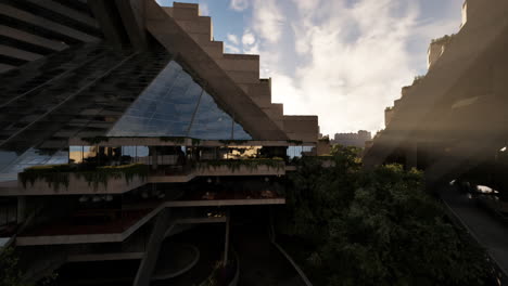 futuristic concrete building with geometric shapes and green plants