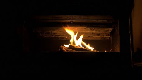 cozy flames in fireplace dolly slide to close up cinematic