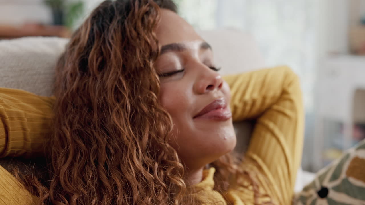 Woman Relaxing on Couch at Home